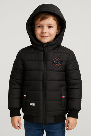 Young boy in a black puffer jacket